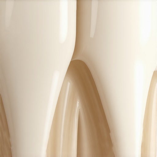A macro view of healthy, mineralized tooth enamel showing a smooth and reflective surface.